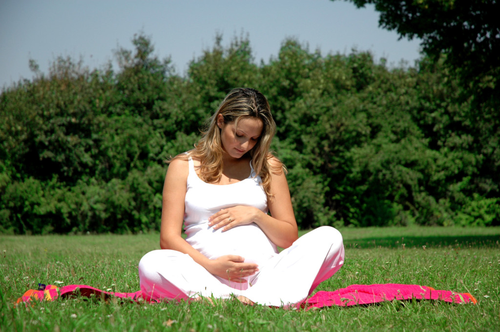 Pregnant Lady Sitting on Grass